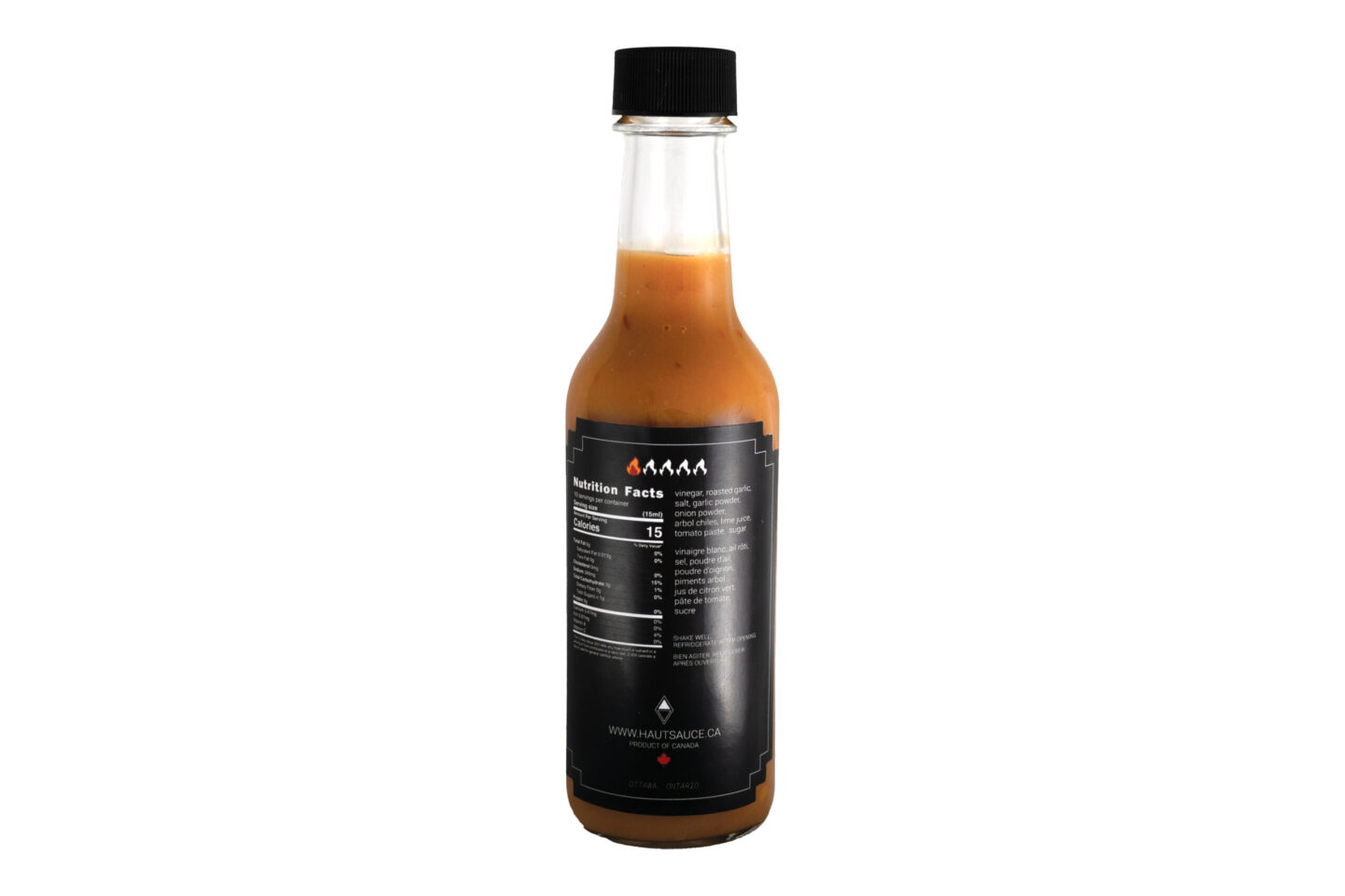 Back label view of The Everyday hot sauce by Haut Sauce Co. Heat scale 1 out of 5. Ingredients vinegar, roasted garlic, salt, garlic powder, onion powder, arbol chiles, lime juice, tomato paste, sugar.